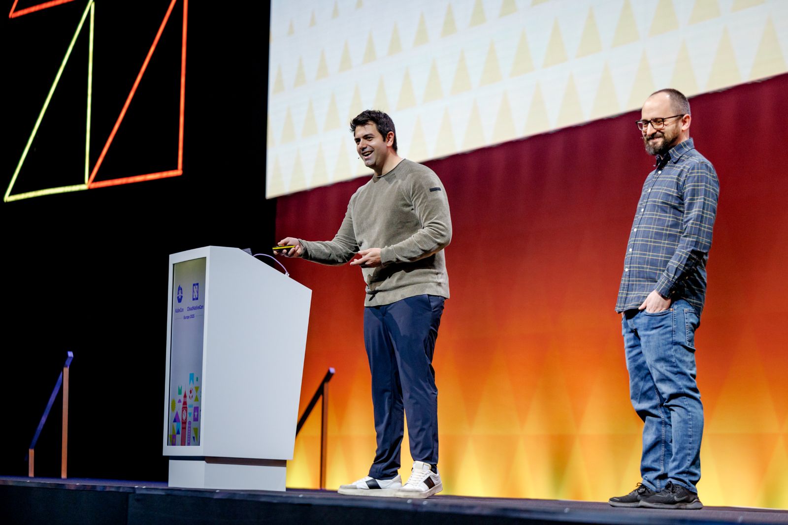 Carlo Fisicaro and Fabio Airoldi on stage at KubeCon 2025